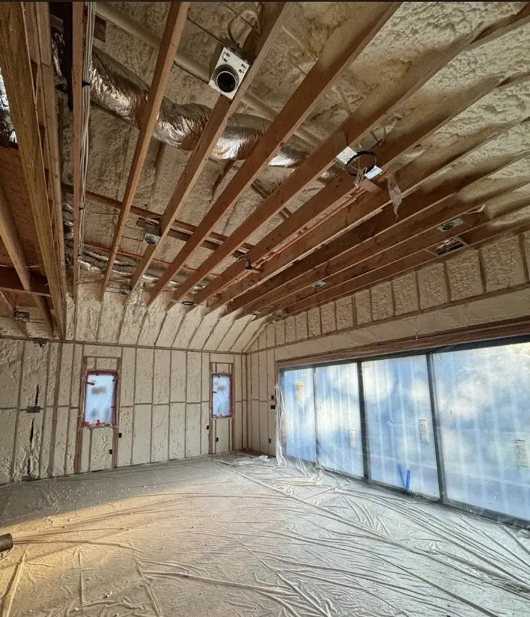 Interior walls and ceiling insulated with spray foam during new construction in New Britain
